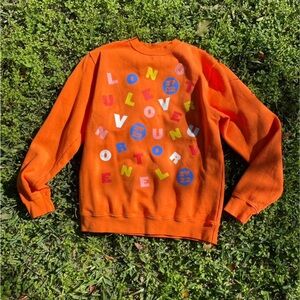 Harry Styles love on tour sweatshirt.